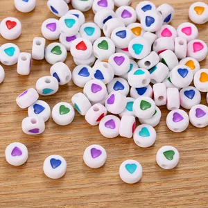 Macro shot of 7mm colorful heart-patterned resin beads for DIY jewelry making
