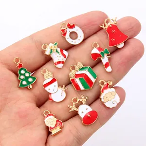 Detail of Christmas enamel alloy charms featuring Santa, reindeer and tree for DIY jewelry