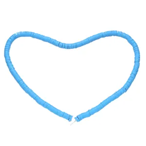 Sky blue Heishi beads arranged in a heart shape for DIY jewelry making material