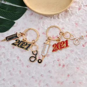 Medical nurse keychain with stethoscope, syringe and 2021 pendant in red and black colors