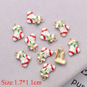 Close-up of 10 Christmas stocking charms with red stripes and 1.7x1.1cm size detail