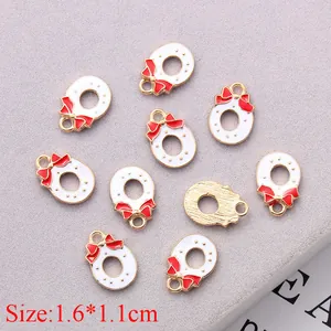 Detailed view of 10-piece Christmas wreath enamel charms measuring 1.6x1.1cm for DIY jewelry