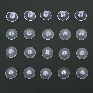 Detailed grid view of twenty transparent silicone earring backs on a black background