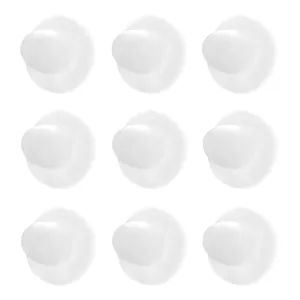 Detailed view of nine translucent white silicone disk earring backs in a 3x3 grid layout