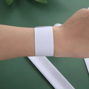 DIY white PVC snap bracelet for creative graffiti styling on a minimalist wide wristband