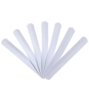 Set of seven white DIY blank slap bracelets made of flexible PVC steel for creative crafts