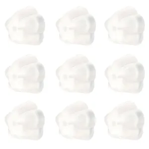 Macro detail of transparent silicone flower-shaped earring backs in a grid layout