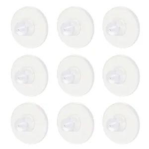 Macro detail of transparent silicone earring back replacements in organized grid display