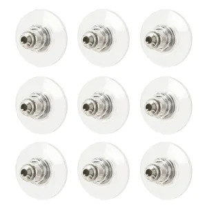 Macro detail of clear disc bullet earring backs made of alloy and pvc materials