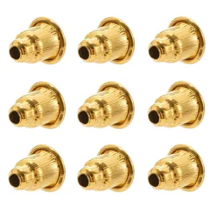 Detailed view of nine gold-plated bullet-shaped earring backs with non-slip texture
