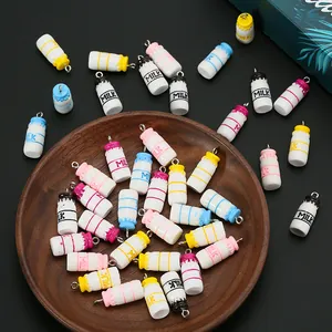 Detailed view of colorful resin milk bottle pendants for DIY handmade jewelry crafts