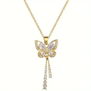 Elegant gold butterfly pendant necklace with pear-shaped cubic zirconia and tassels