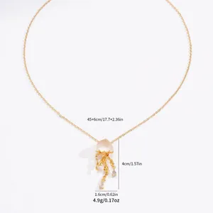 Micro-inlaid jellyfish pendant necklace in gold with pink stone and white crystals