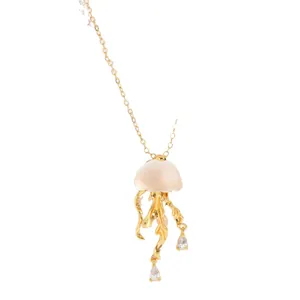 Gold floating jellyfish necklace with translucent head and zircon crystal tentacles