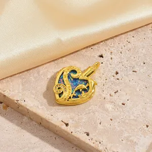Detail of gold heart locket with Always in my heart engraving and dolphin motif
