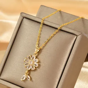 Elegant gold flower necklace with clear zircon petals on premium champagne silk