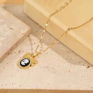 Vintage gold necklace featuring a black cameo pendant with zircon halo and bow accent