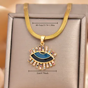 Detail of gold snake chain with blue evil eye pendant showing 40+5cm length measurement