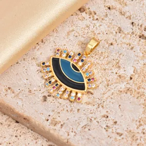 Hiphop evil eye pendant in gold with colorful cubic zirconia and blue enamel detail