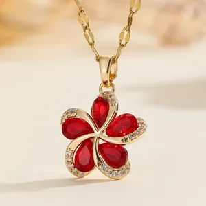 Elegant gold-tone stainless steel necklace with a red pear-shaped crystal flower pendant