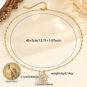 Golden flower pendant necklace in stainless steel with white zircon pavé and coin reference