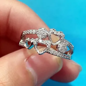 Elegant double layered silver heart ring with micro-paved cubic zirconia crystals on a model