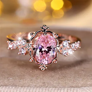 Elegant rose gold ring with oval pink zircon and vintage baroque hollowed patterns