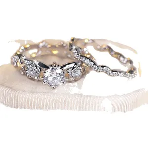 Silver flower ring set with micro-paved cubic zirconia and hollow floral band