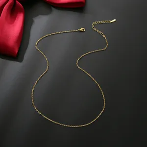 14K gold plated cable chain necklace with lobster clasp and adjustable extension on black