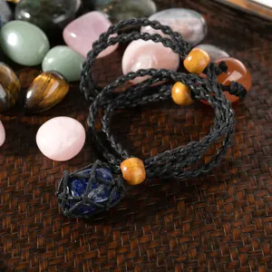 Handmade woven net necklace featuring a natural lapis lazuli stone with wood bead accents