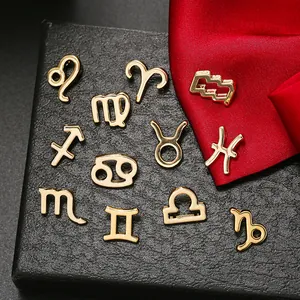 Set of 12 gold alloy zodiac sign charms for DIY necklaces and bracelets on black leather