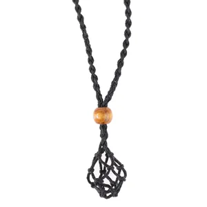 Detail of black hand-woven wax cord necklace with wooden bead and stone mesh pouch