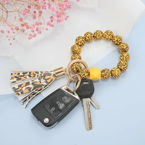Schlüsselanhänger Armband mit Leopardenmuster, gelber Perle und goldenem Ring