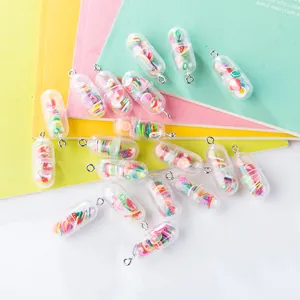 Macro detail of colorful fruit capsule pendants with silver metal rings for DIY jewelry