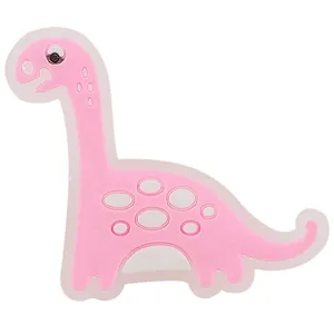 Detaillierte Makroansicht des pinkfarbenen Silikon-Dinosauriers für Gartenschuhe (leuchtend)