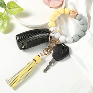 Handmade silicone bead keychain wristlet with wood bead and yellow leather tassel