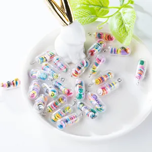 Close-up of cute capsule pendants with colorful smiley faces and silver metal rings