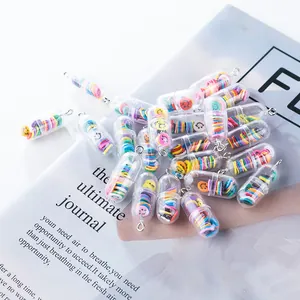 Macro shot of colorful smiley pill charms with silver loops for DIY jewelry making