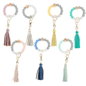 Fashion Silicone Beaded Wristlet Keychain For Women With PU Leather Tassel Wood Bead Eye Pattern Bracelet Key Ring For Everyday Travel