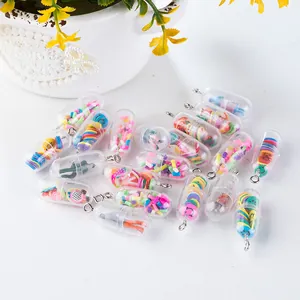 Close-up of creative pill capsule charms with colorful fruit slices and smiley face fillings