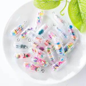 Macro shot of colorful transparent capsule charms filled with fruit slices and smiley faces