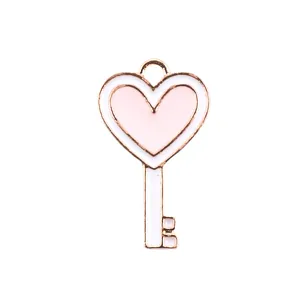 Detailed view of heart-shaped gold alloy pendant with pink and white enamel finish