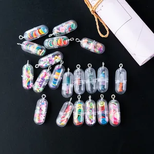 Macro shot of creative pill capsule charms with fruit slices and mini figures inside
