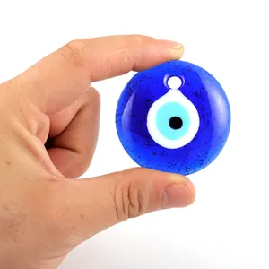 Macro detail of Turkish blue glass Evil Eye pendant showing craftsmanship and texture