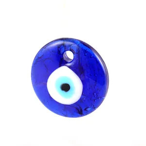 Detailed close-up of blue glass Evil Eye pendant with translucent texture and top hole