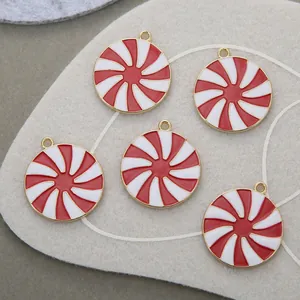 Five pieces of red and white spiral peppermint-style round pendants with gold alloy plating