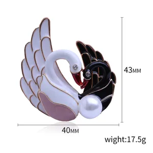 Elegante broche de cisne en esmalte blanco y negro con cristales y gran perla decorativa