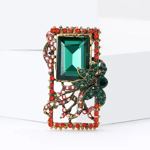 Baroque emerald crystal brooch with red rhinestones and vintage gold floral design