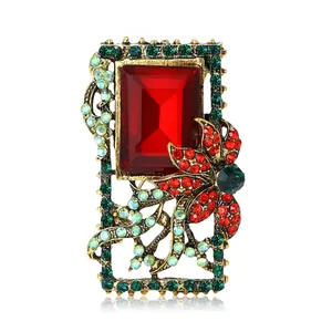 Baroque retro brooch with large rectangular red crystal and green rhinestone floral accents