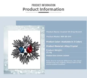 Macro detail of enamel flower brooch with ruby red and dark blue crystals